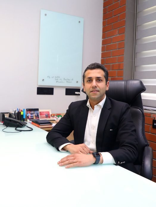 The firm’s founder at his desk in the Delhi office