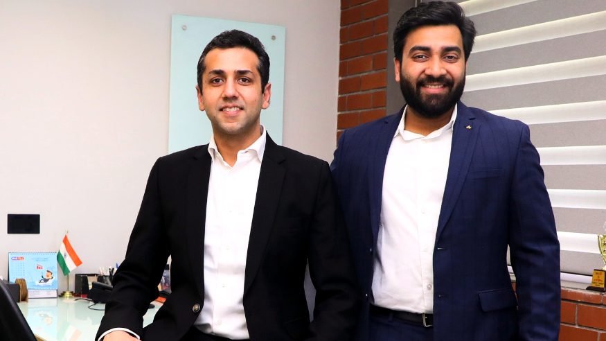 Two of the firm’s advisers at a desk in the Delhi office
